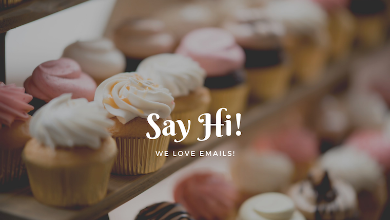 cupcakes in a bakery with text overlay " Say Hi! We love emails"