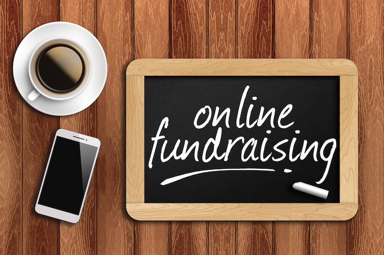 coffee, phone and chalkboard with words "online fundraiser"