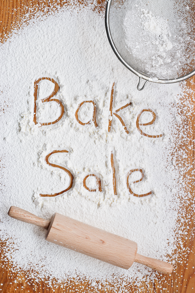 bake sale written in flour, with a rolling pin